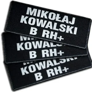 Imiennik odblaskowy tło czarne 1-3 linijki tekstu na rzepie 13 x 5 cm Oryginalny