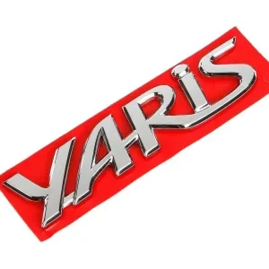 TOYOTA Yaris Chromowany emblemat logo tyl YARIS 75442-0D150 OE Autentyczny